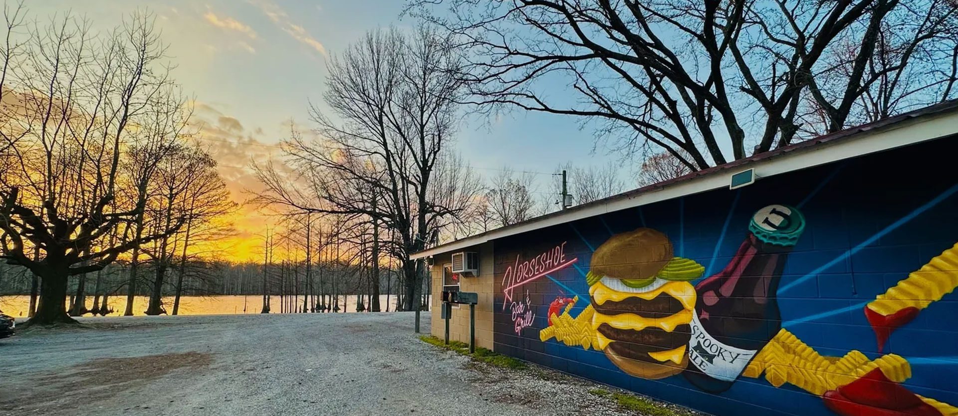 A mural of a hamburger on the side of a building.