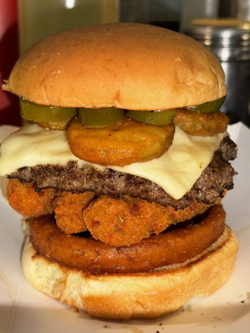 closeup shot of delicious Ashlyn Deluxe Burger